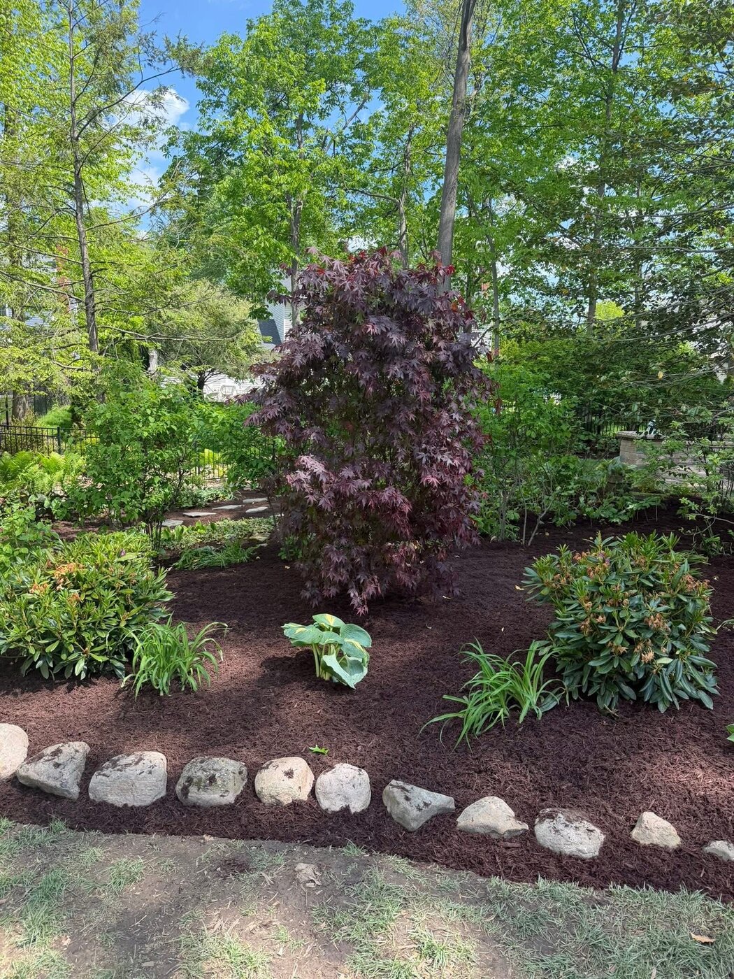 Stone-Bordered Mulch Bed